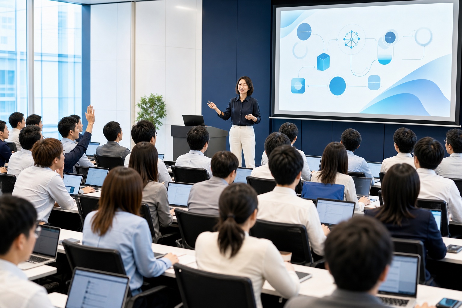 幅広い年代の社員が一人1台のパソコンを使う大人数の生成AI全体研修